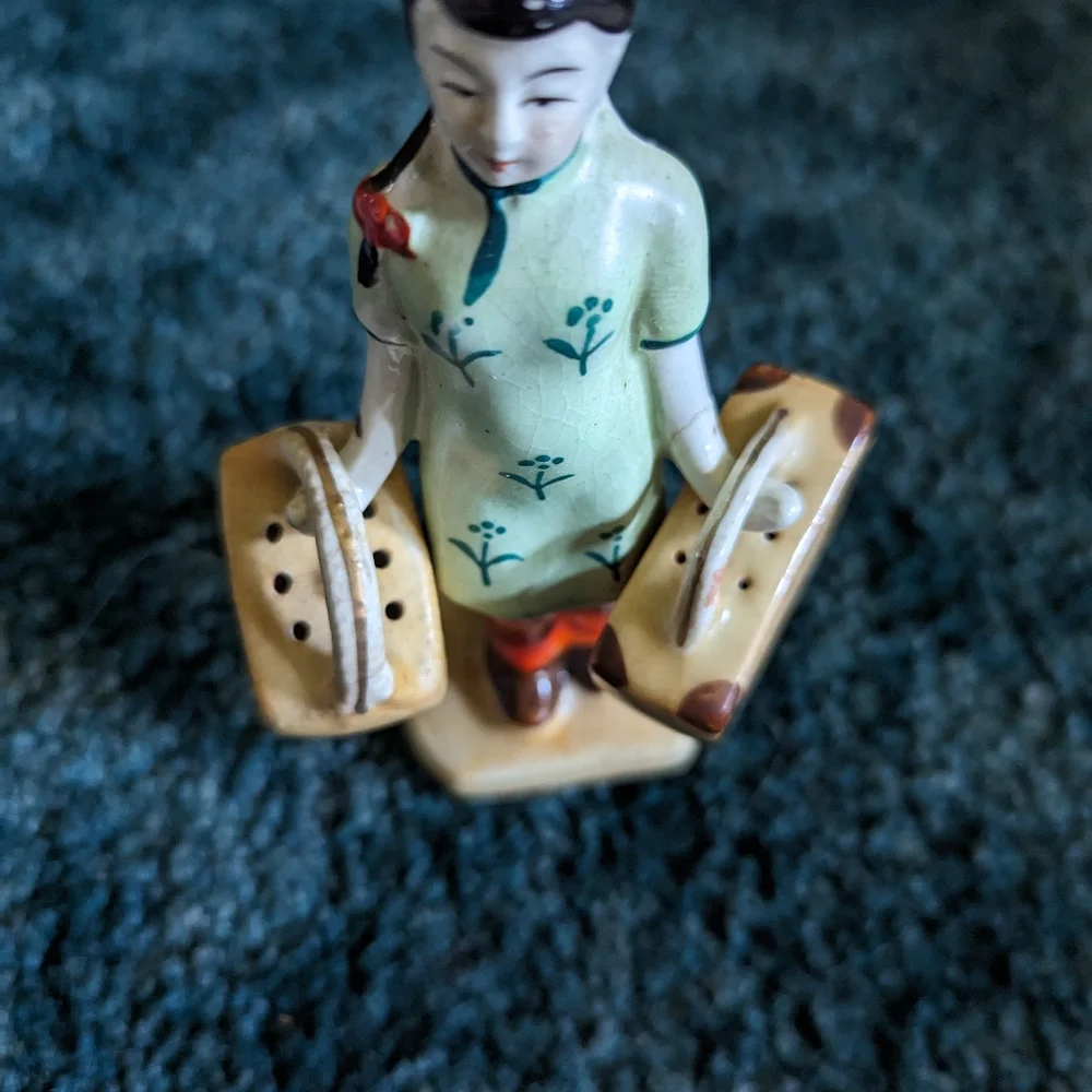 Vintage salt and pepper woman w luggage